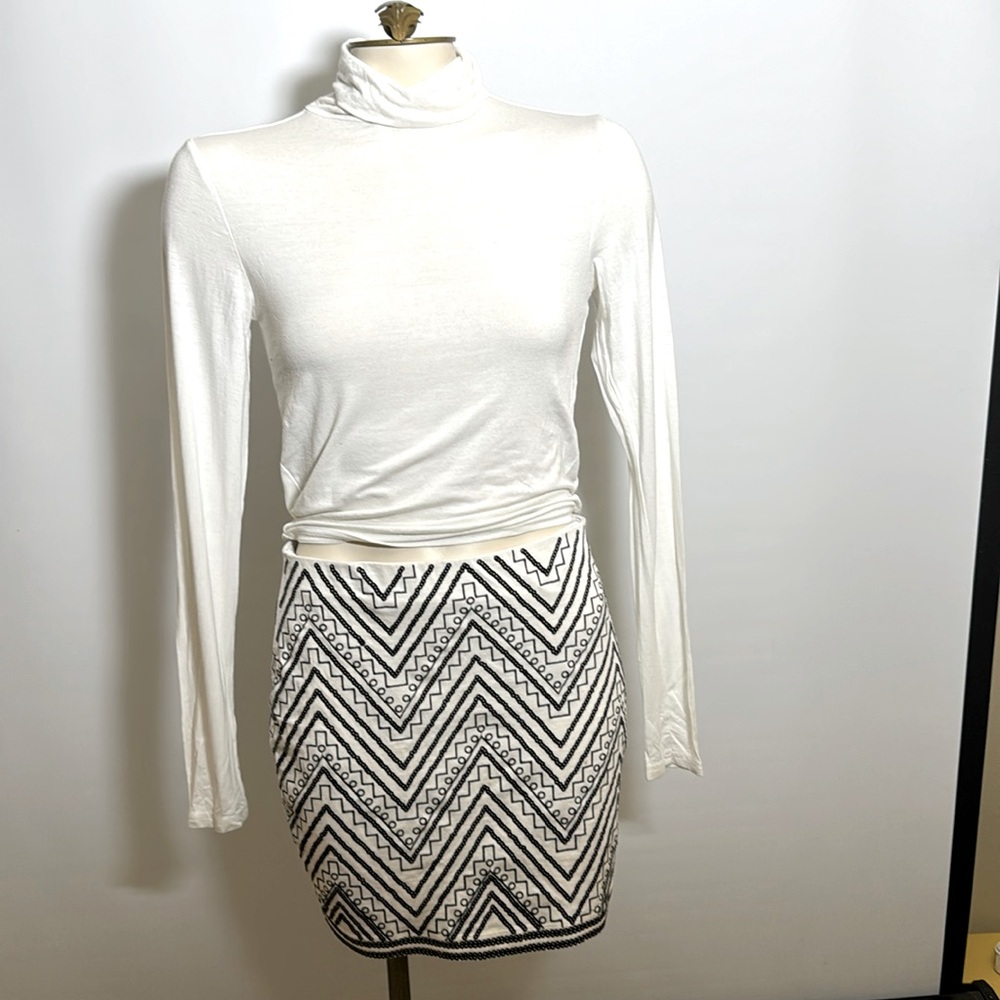 Express mini skirt with black and white sequins design.